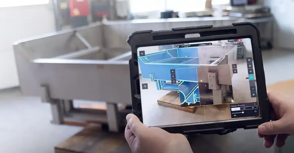 Tablet running Twyn compares a physical component with CAD data during a visual quality inspection at MAFO.